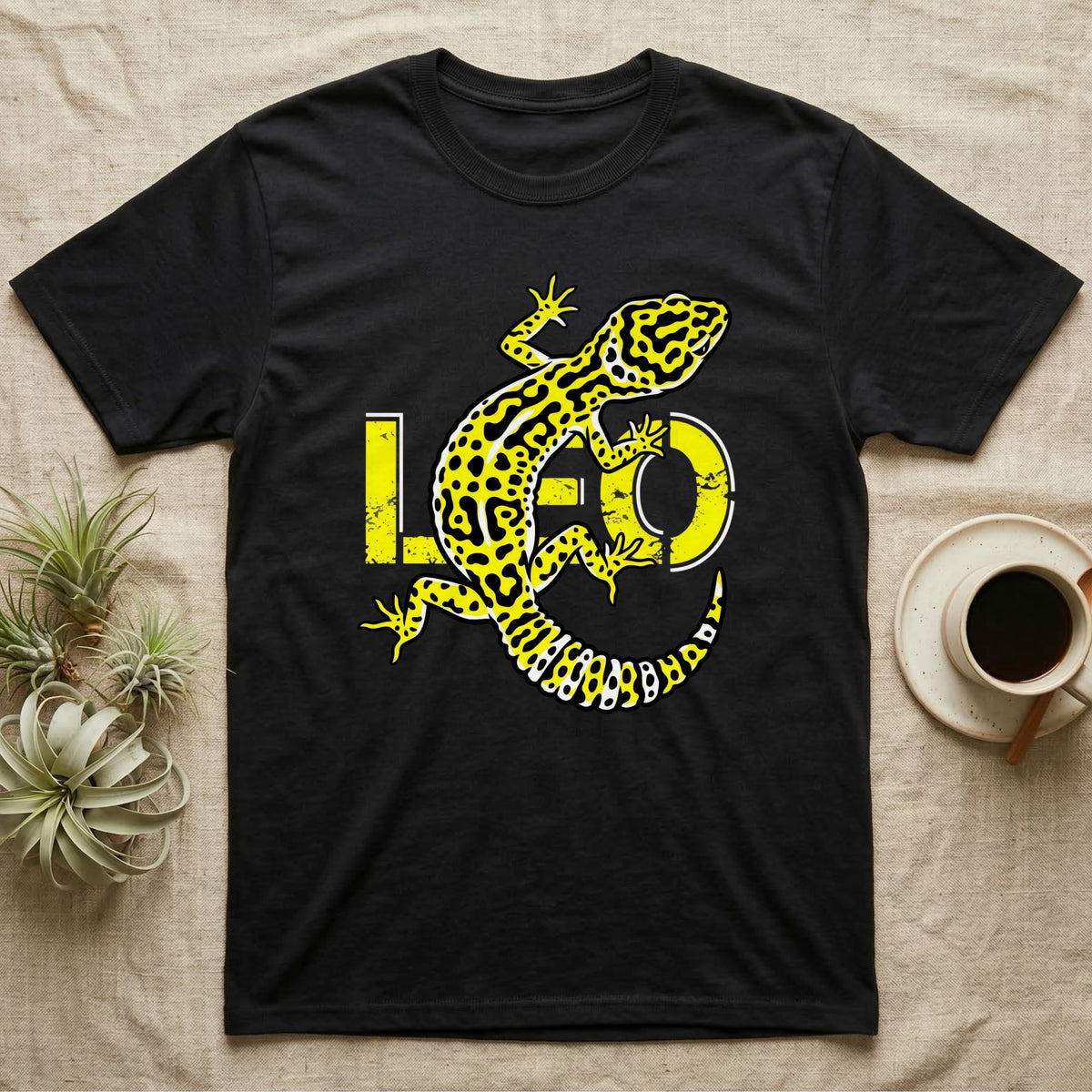 Black t-shirt with a yellow and black leopard gecko design and the word "LEO".