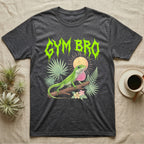 Green Anole Feral T-Shirt in Dark Heather — Green anole mid push-up with flared pink dewlap under a jagged neon-lime metal "GYM BRO" wordmark and pastel ferns.