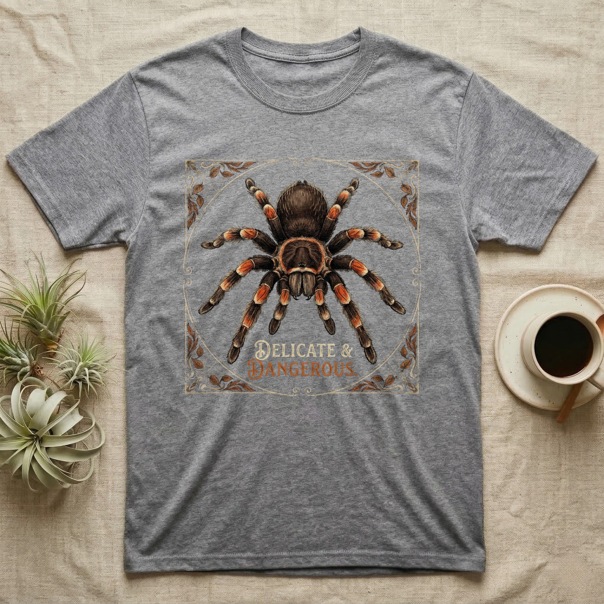 Grey t-shirt with tarantula graphic and "DELICATE & DANGEROUS" text.