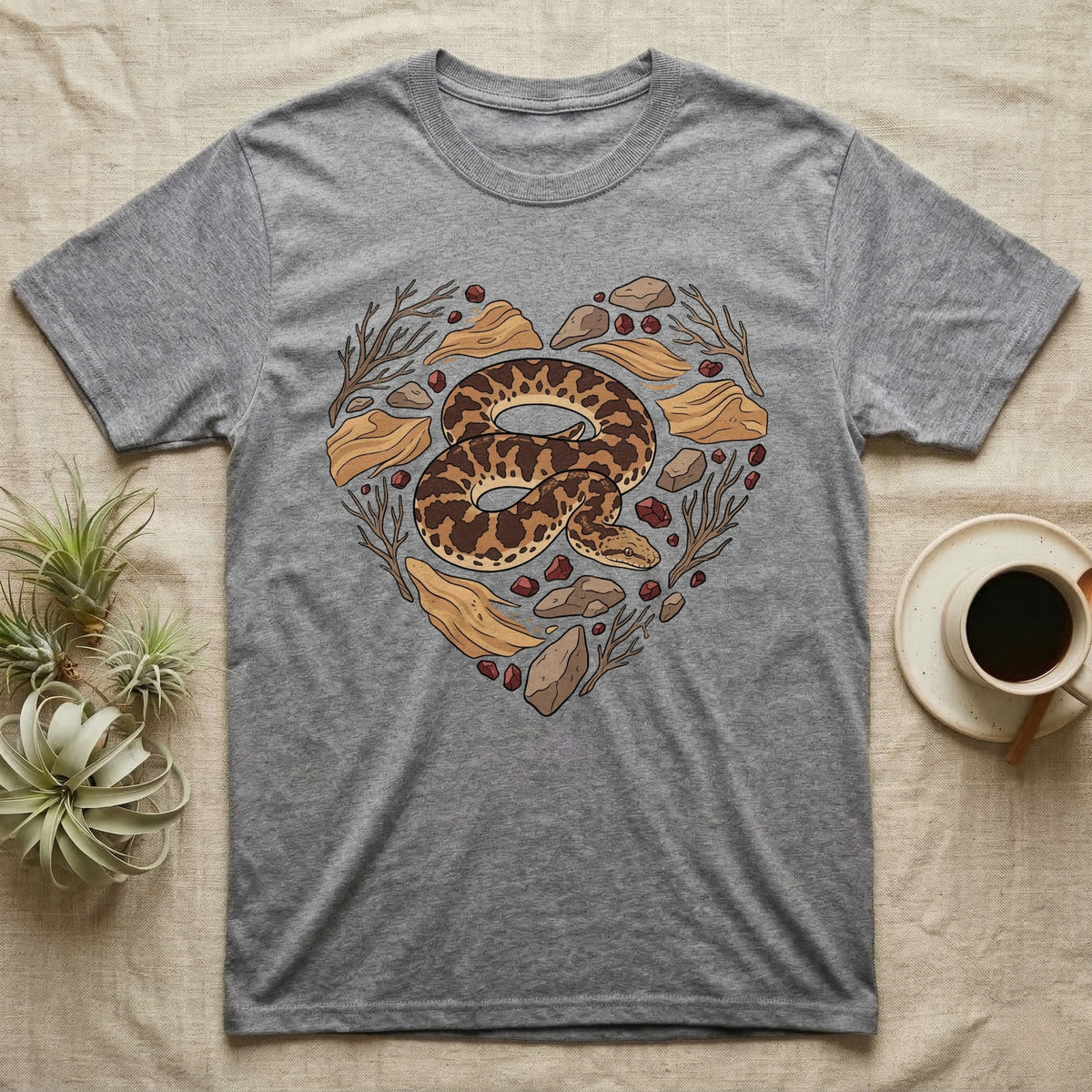 Gray t-shirt with a heart-shaped snake and natural elements design.