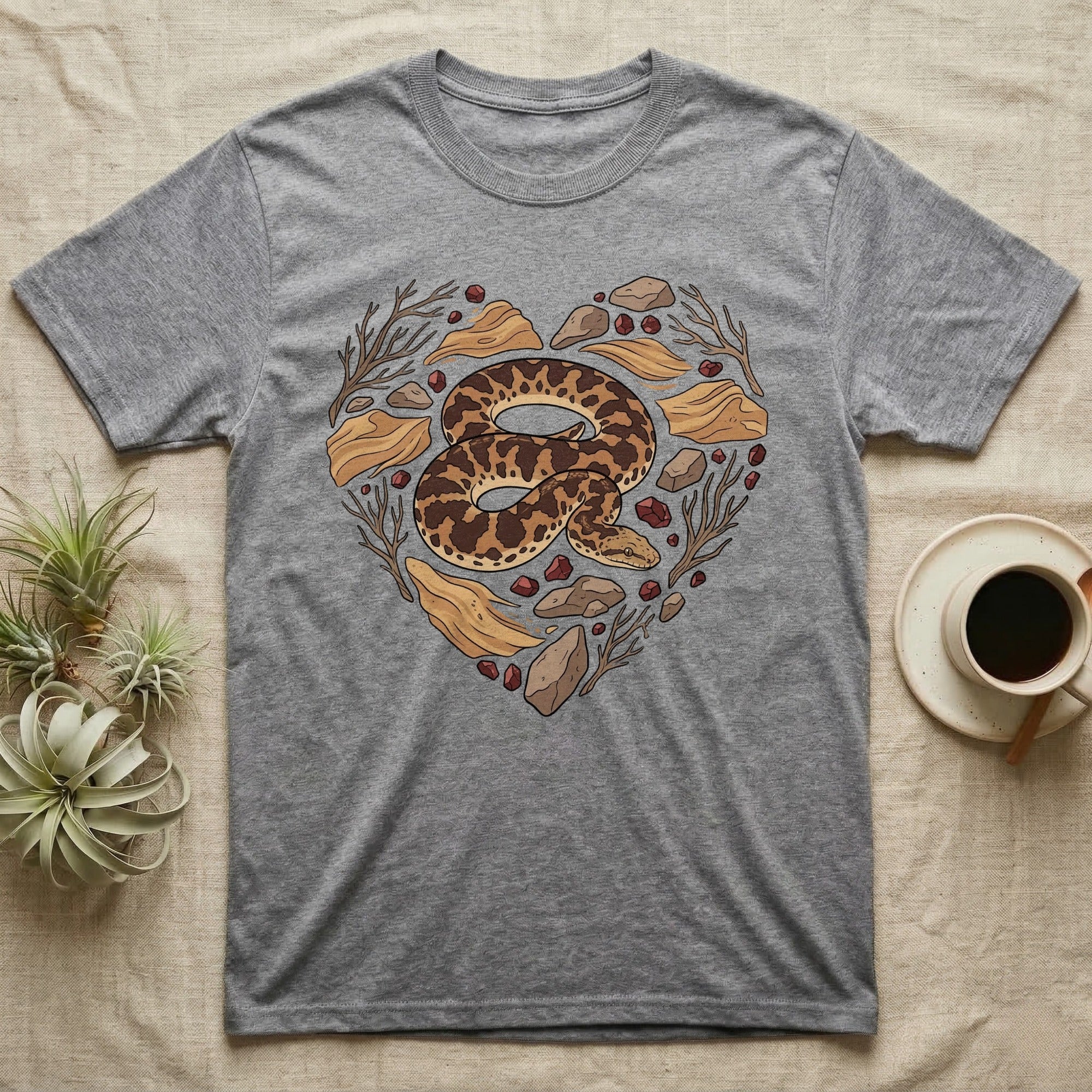 Gray t-shirt with a heart-shaped snake and natural elements design.