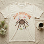 Goliath Birdeater Feral T-Shirt in Natural — Goliath birdeater tarantula with bristly legs spread under jagged copper metal text BIGGER THAN YOUR HAND