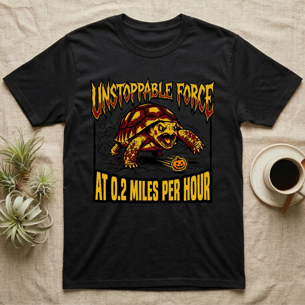 Red-Footed Tortoise Unstoppable Force T-Shirt in Black — Metal-style furious tortoise charging a candy pumpkin, "Unstoppable Force At 0.2 Miles Per Hour."