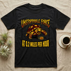 Red-Footed Tortoise Unstoppable Force T-Shirt in Black — Metal-style furious tortoise charging a candy pumpkin, "Unstoppable Force At 0.2 Miles Per Hour."