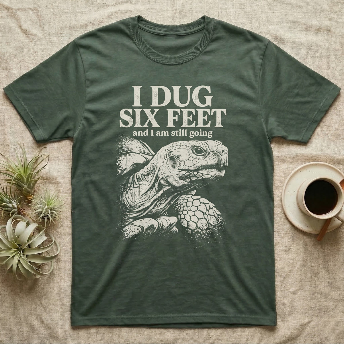 Sulcata Tortoise Dug Six Feet T-Shirt in Military Green — One-ink white sulcata tortoise portrait on black under the words I DUG SIX FEET and I am still going.