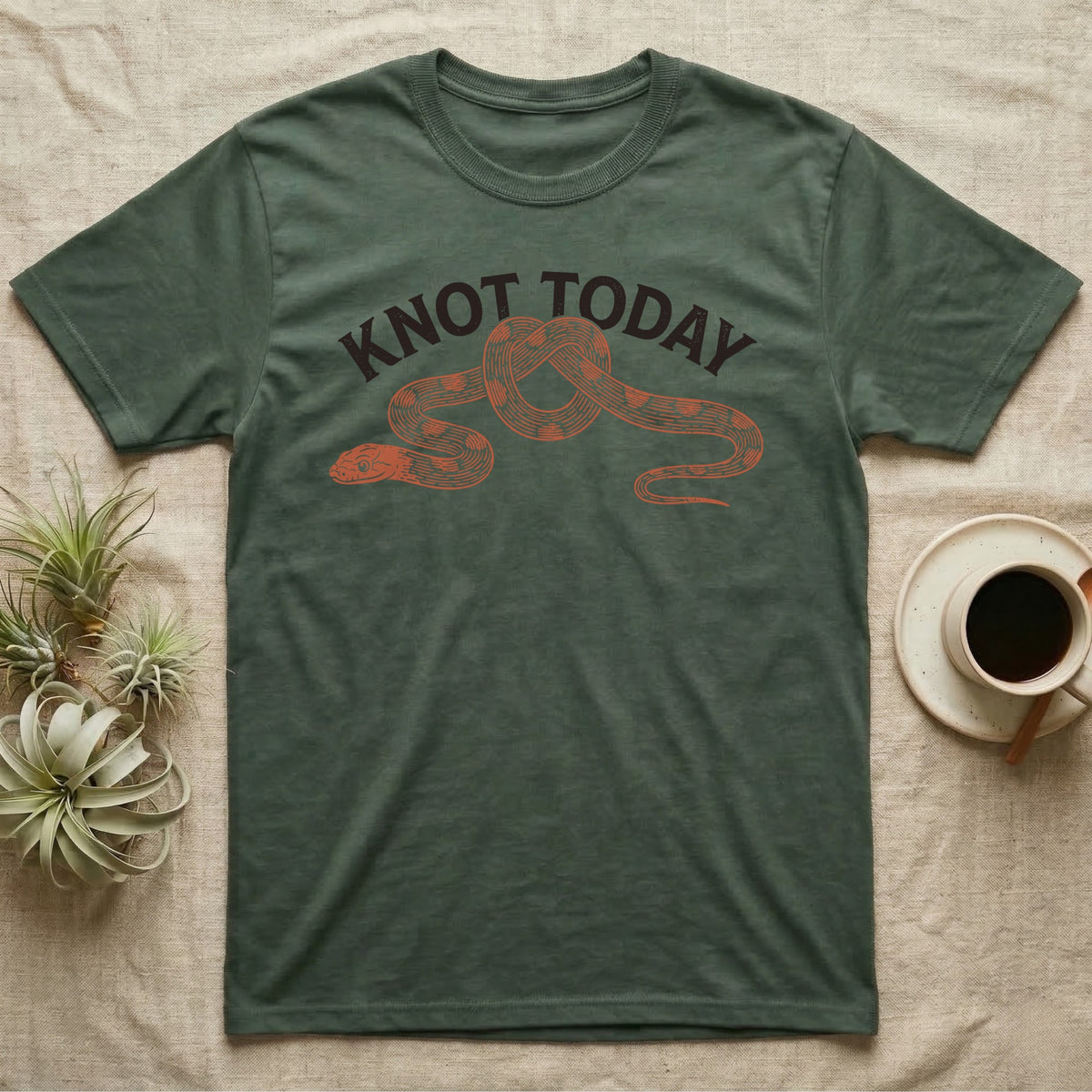 Corn Snake Knot Today T-Shirt in Military Green — Worn-stamp corn snake stretched into a half-tied bow beneath a fat arched "KNOT TODAY" headline.
