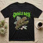 Leachianus Gecko Feral T-Shirt in Black — Leachianus giant gecko on a mossy branch under jagged lime-green metal text GROWLS BACK with pastel leaves