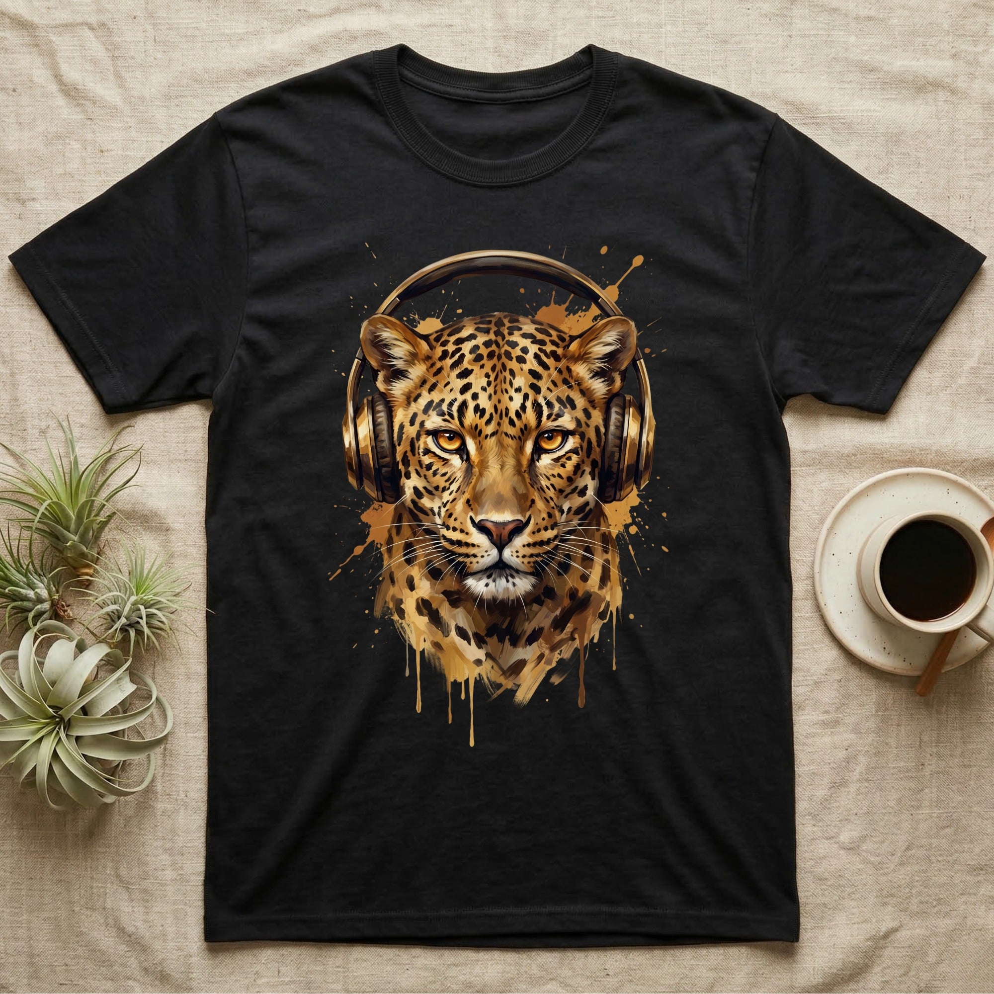 Black t-shirt featuring a watercolor-style leopard wearing headphones.