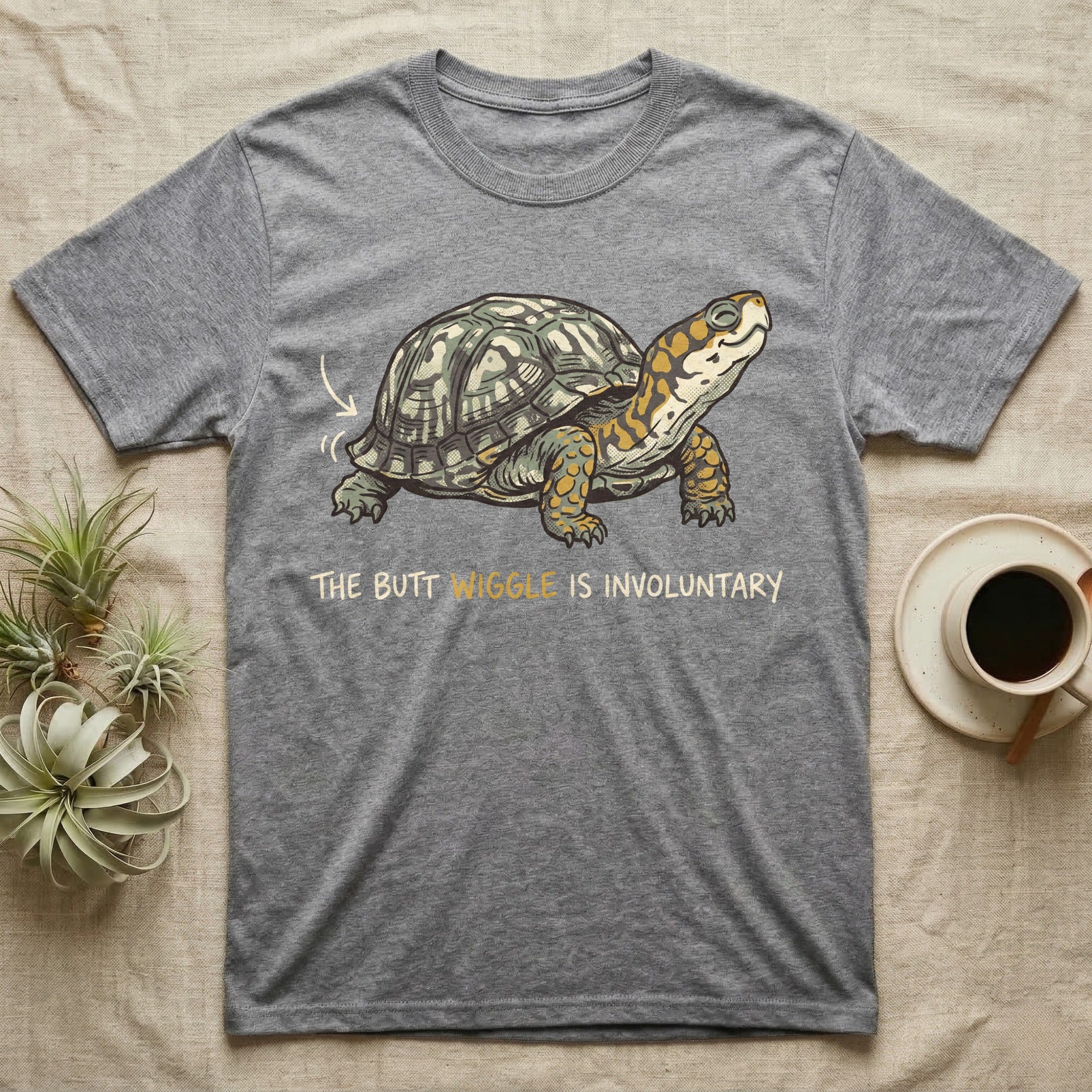 Box Turtle Wiggle T-Shirt in Sport Grey — Retro-illustration of a box turtle mid shell-scratch with a hand-drawn arrow at its wiggling rear and a deadpan marker caption.