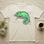Cream t-shirt with green chameleon illustration and stylized clouds.