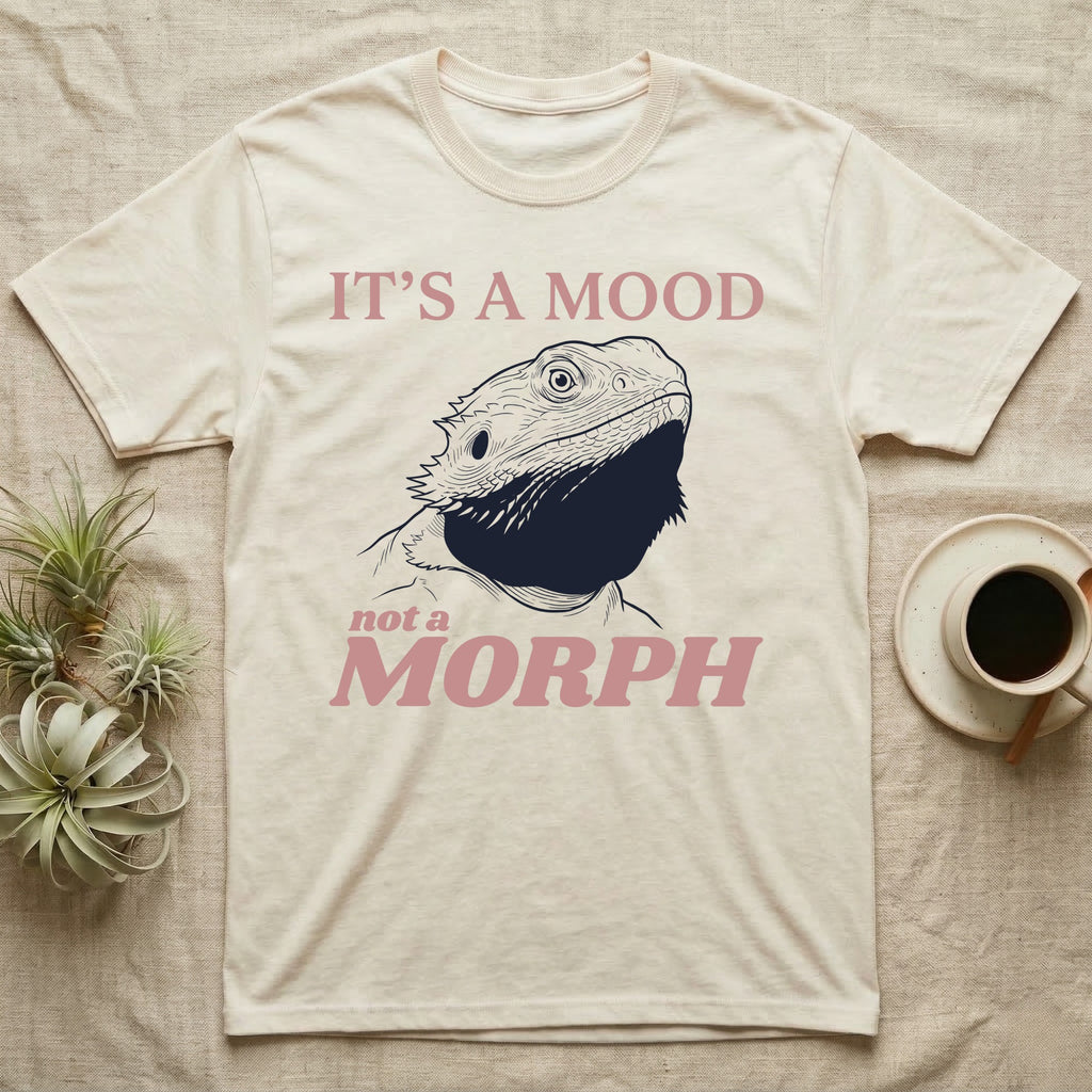 Bearded Dragon Black Mood T-Shirt in Natural — Engraved bearded dragon with a fully flared black beard, between the words It's A Mood and morph in dusty rose.