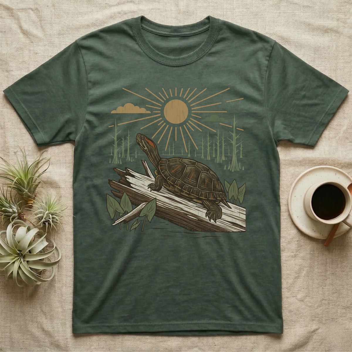 Red-Eared Slider Home Range T-Shirt in Military Green — Woodcut-style illustration of a red-eared slider basking on a half-sunk log in a cypress swamp under a full sun, no on-shirt text.