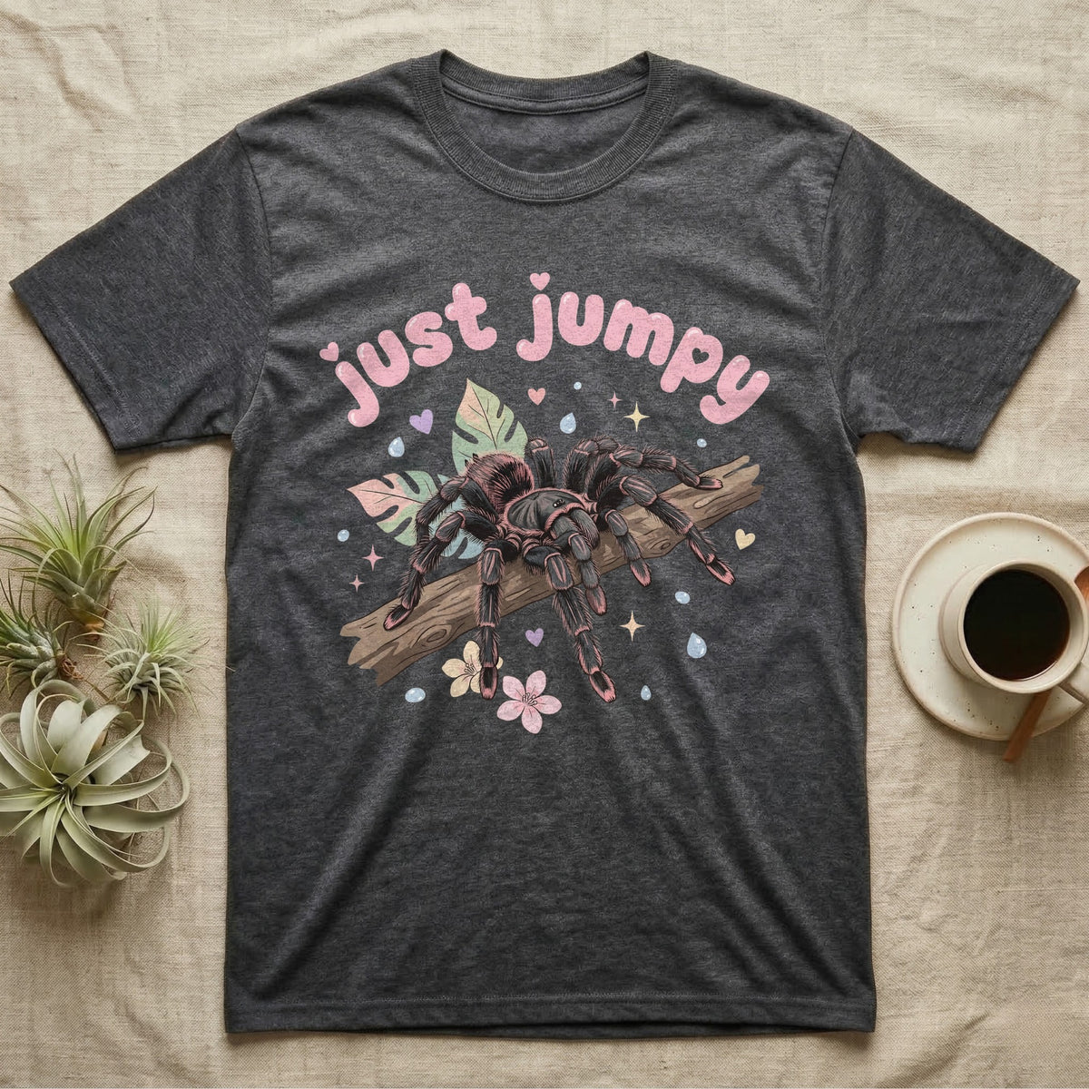 Pink Toe Tarantula Softie T-Shirt in Dark Heather — Pink toe tarantula poised to leap on a branch under a puffy pastel "just jumpy" bubble wordmark with tiny hearts.