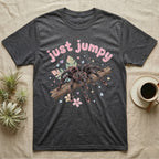 Pink Toe Tarantula Softie T-Shirt in Dark Heather — Pink toe tarantula poised to leap on a branch under a puffy pastel "just jumpy" bubble wordmark with tiny hearts.