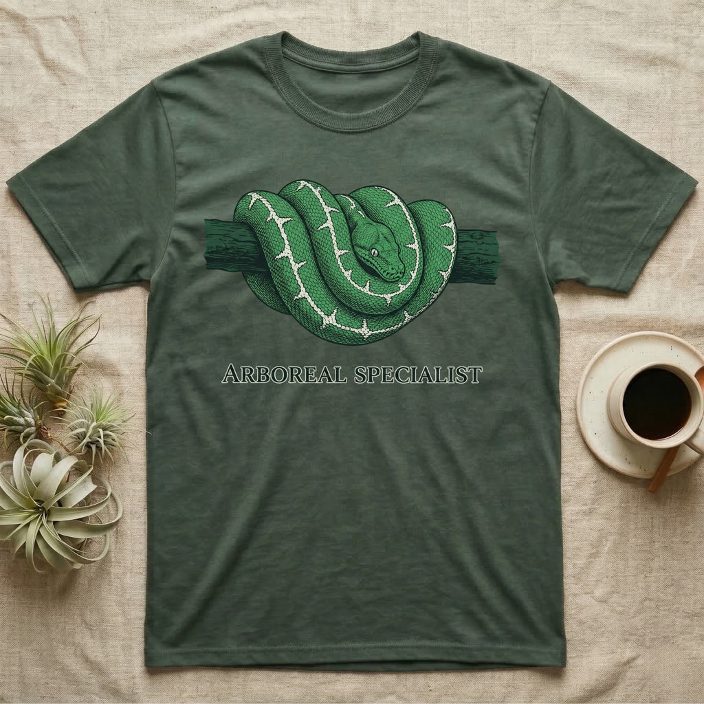 Green t-shirt with an illustration of a coiled green tree python and the text "Arboreal Specialist".