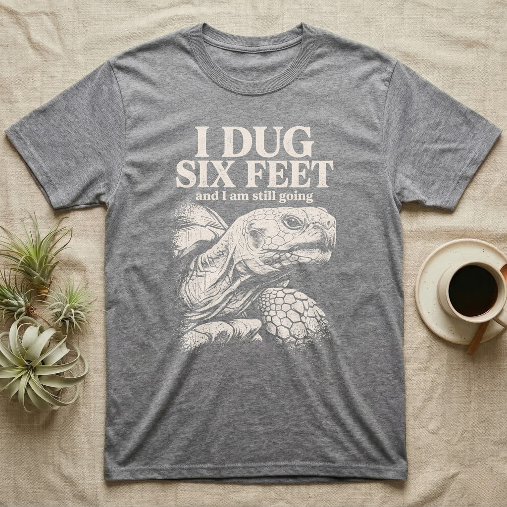 Sulcata Tortoise Dug Six Feet T-Shirt in Sport Grey — One-ink white sulcata tortoise portrait on black under the words I DUG SIX FEET and I am still going.
