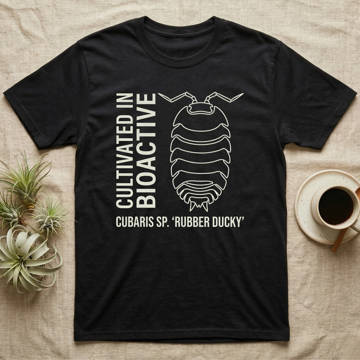 Rubber Ducky Isopod Line Art T-Shirt in Black — Bone-white outline drawing of a rubber ducky isopod labelled Cubaris sp. beside vertical stencil type.