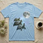 Hermann's Tortoise Moon Howl T-Shirt in Light Blue — Three Hermann's Tortoise colour morphs howling at a full moon over a nebula on a dark grey t-shirt.