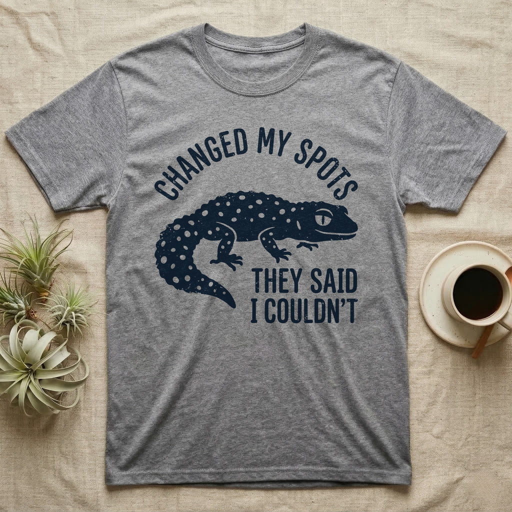 Leopard Gecko Spots T-Shirt in Sport Grey — Navy silhouette of a spotted leopard gecko walking under arched words Changed My Spots, beside They Said I Couldn't