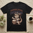 Bearded Dragon Drummer T-Shirt in Black — Sepia woodcut bearded dragon as a Revolutionary drummer boy under ornate text Founding Father of the Freedom Nap.