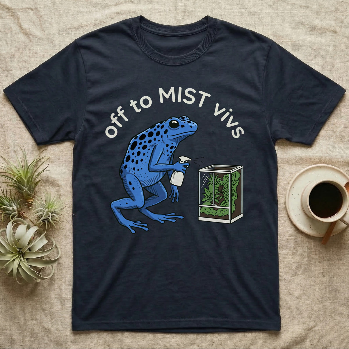 Dart Frog Misting T-Shirt in Navy — Spotted blue dart frog spraying a planted vivarium under the words off to MIST vivs