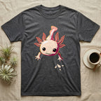 Cute chibi illustration of a smiling cream and coral-pink axolotl floating with splashing water droplets, no on-shirt text. — shown on a Dark Heather tee.