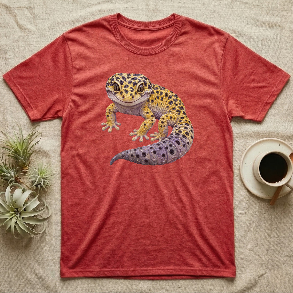 Red t-shirt with a colorful gecko illustration centered on the chest.