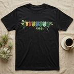 Green Tree Python Canopy Crew T-Shirt in Black — Watercolor illustration of a green tree python in seven real colour-change stages coiled on a branch, dark grey T-shirt design.