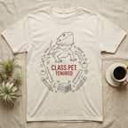 Bearded Dragon Class Pet T-Shirt in Natural — Bearded dragon in a heroic head-up pose ringed by outline school motifs with CLASS PET TENURED text on grey