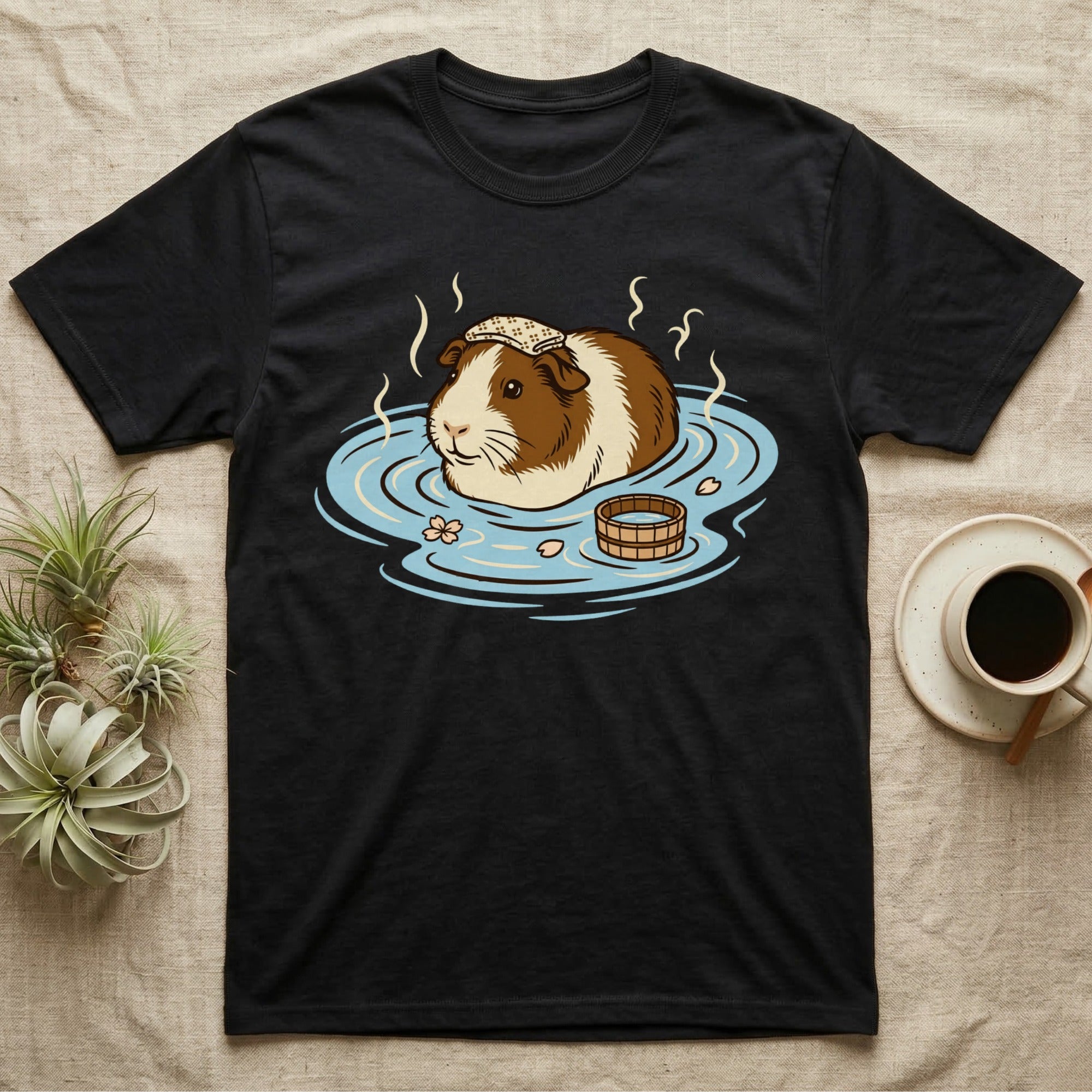 Black t-shirt featuring a guinea pig relaxing in a hot spring.