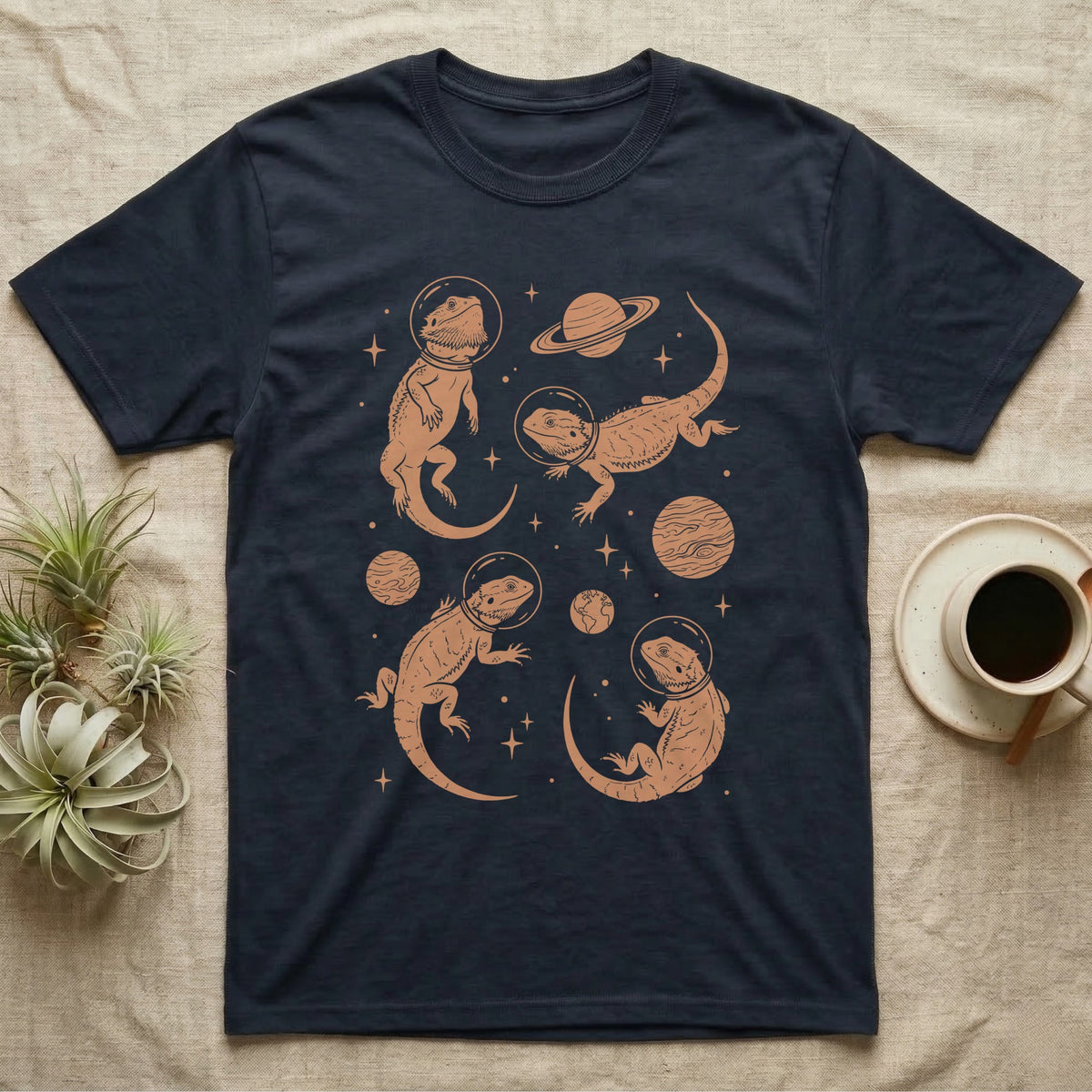 Bearded Dragon Cosmic T-Shirt in Navy — Vintage screen-print illustration of bearded dragons in astronaut helmets floating in space, warm copper monochromatic on dark background.