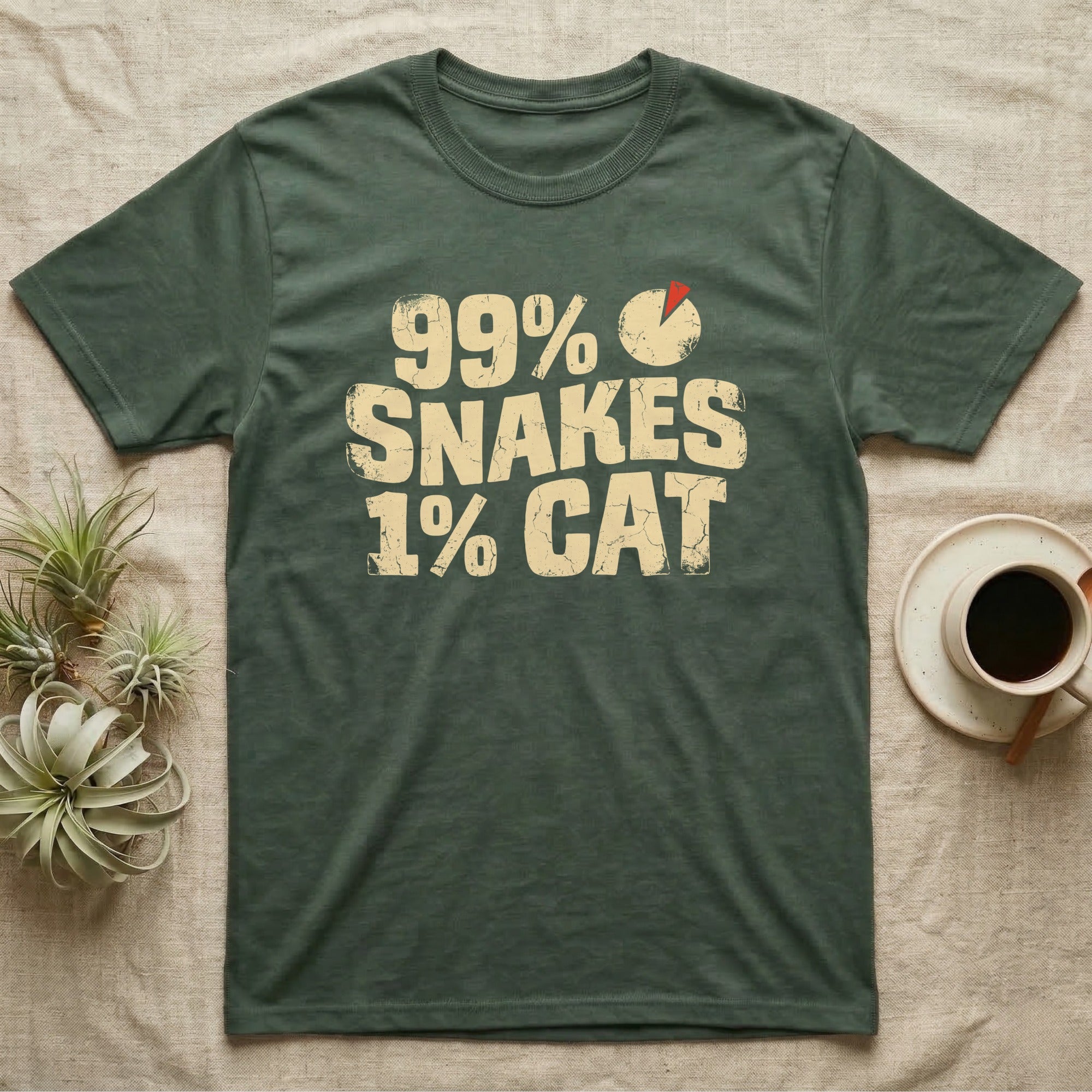 99% Snakes Keeper T-Shirt in Military Green — Distressed-block wordmark reading 99 percent snakes 1 percent cat with a small pie-chart accent glyph.