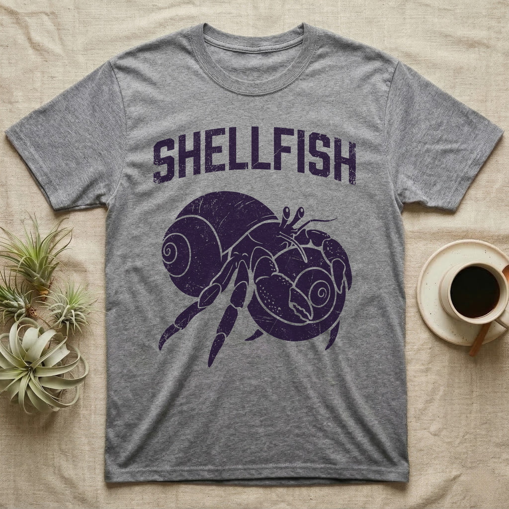 Hermit Crab Shellfish T-Shirt in Sport Grey — Worn purple one-ink print of a hermit crab hugging a big spare shell to its chest under the word Shellfish