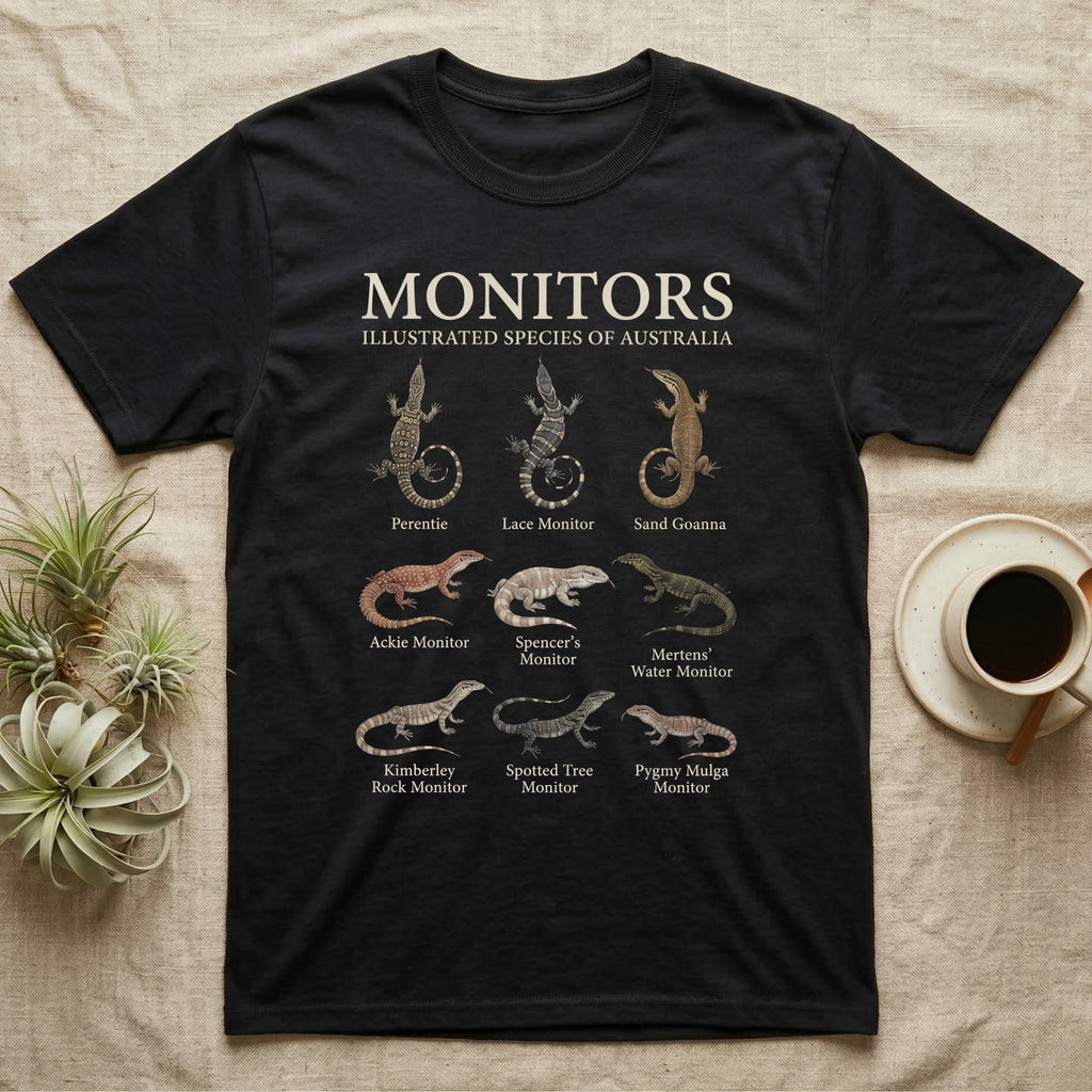 Monitor Species Chart T-Shirt in Black — Watercolour chart of nine named Australian monitor lizards under a cream serif Monitors title