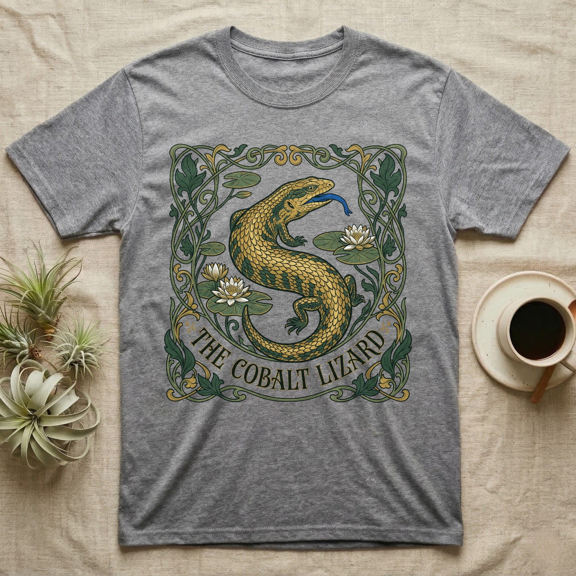 Grey t-shirt with a gold lizard and lotus flowers in an art nouveau design.