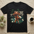 Illustration of a crested gecko hanging tongue-out over a rail among ivy leaves, bold distressed lettering reading Crested Rebel. — shown on a Black tee.