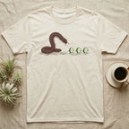 Millipede Cucumber Chase T-Shirt in Natural — A huge giant African millipede rearing up and chasing three small cucumber slices running away on tiny legs.
