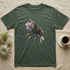 Pink-Toe Tarantula Blossom T-Shirt in Military Green — Watercolor illustration of a charcoal pink-toe tarantula with salmon toe tips holding an orchid blossom sprig, on a dark grey t-shirt.