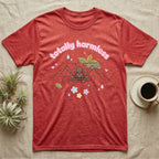 Tailless Whip Scorpion Baby T-Shirt in Heather Red — Pastel tailless whip scorpion with long whip legs among leaves and blossoms, puffy pink wordmark "totally harmless" above.