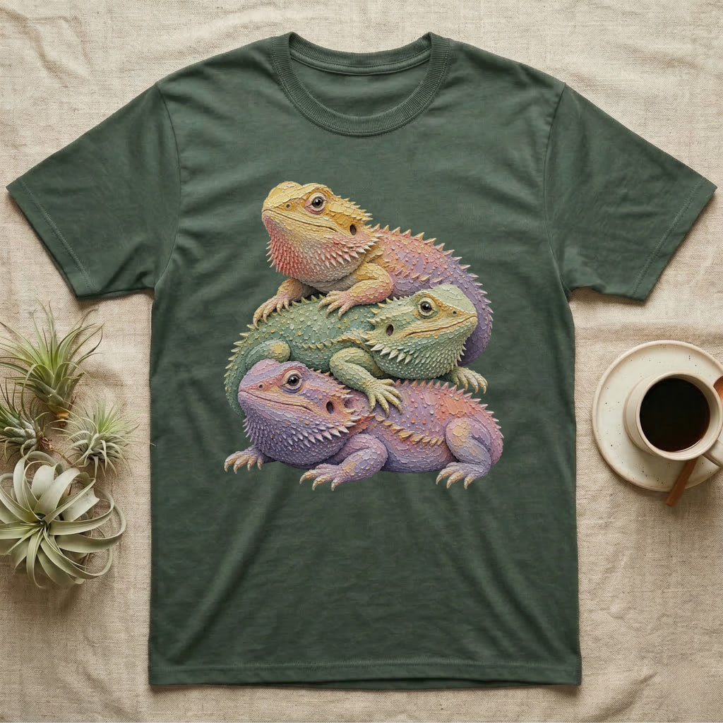 Three bearded dragons stacked on each other, printed on a green t-shirt.
