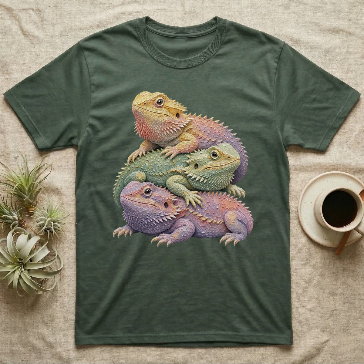 Three bearded dragons stacked on each other, printed on a green t-shirt.
