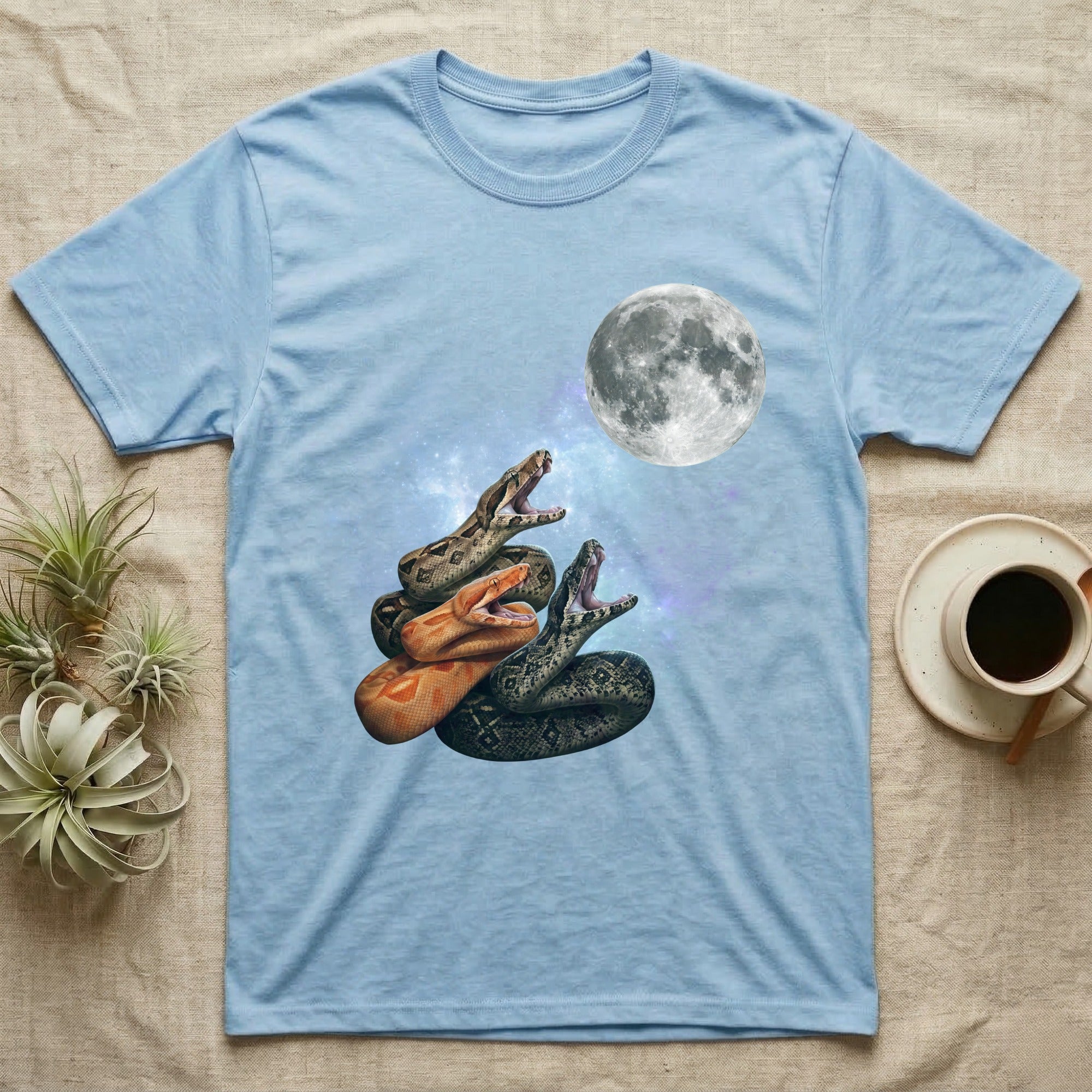 Boa Constrictor Moon Howl T-Shirt in Light Blue — Three Boa Constrictor colour morphs howling at a full moon over a nebula on a dark grey t-shirt.