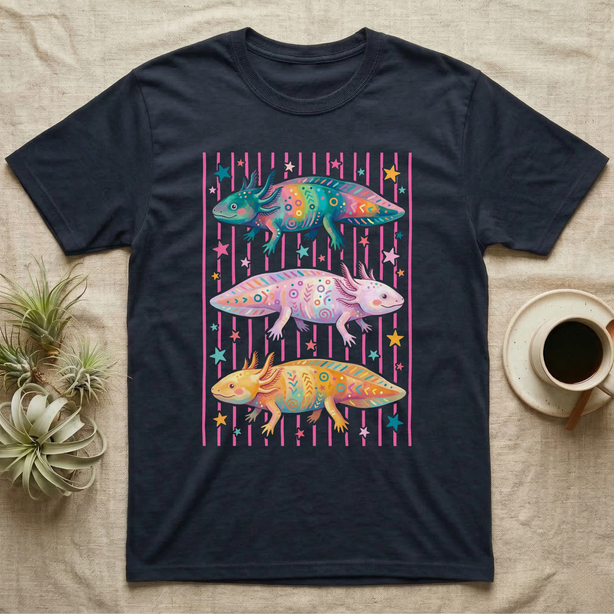 Axolotl Colourways Candy Stripe T-Shirt in Navy — Three gouache axolotls stacked in bands on pink candy stripes, facing left, right and left, with scattered stars