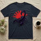 Scorpion graphic tee with red sun and wave design on dark fabric.