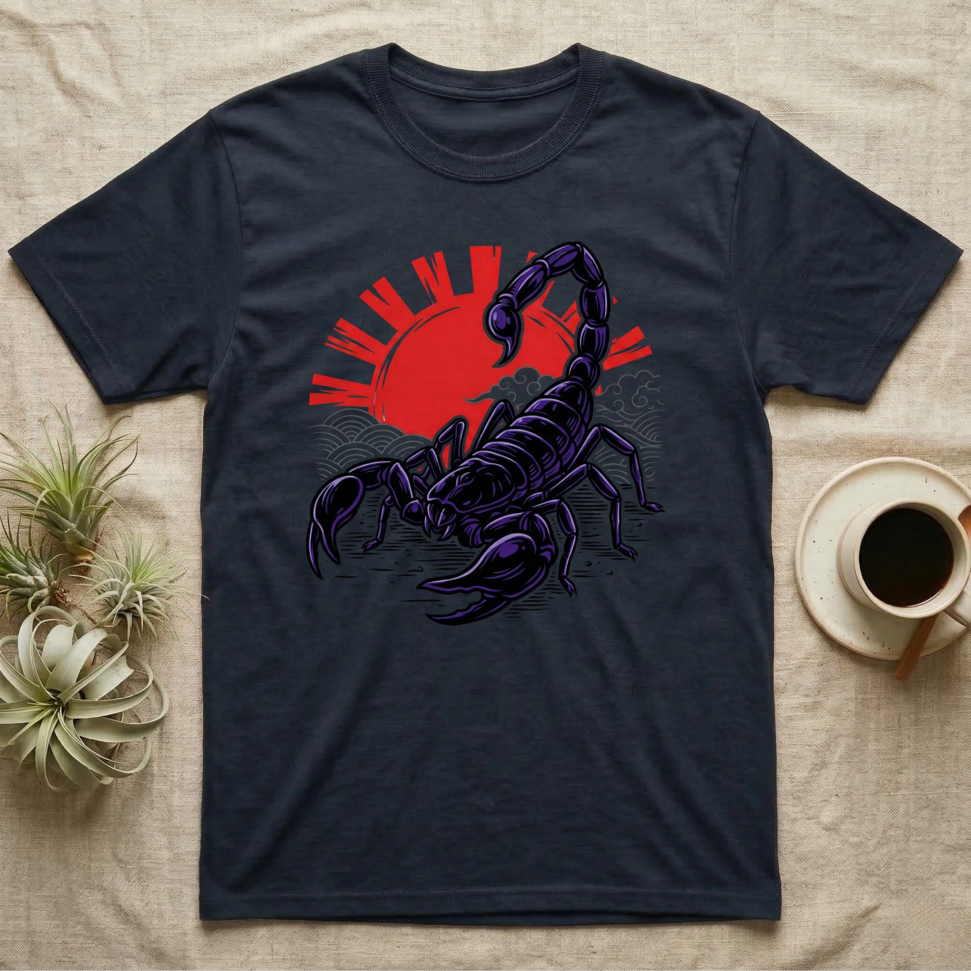 Scorpion graphic tee with red sun and wave design on dark fabric.