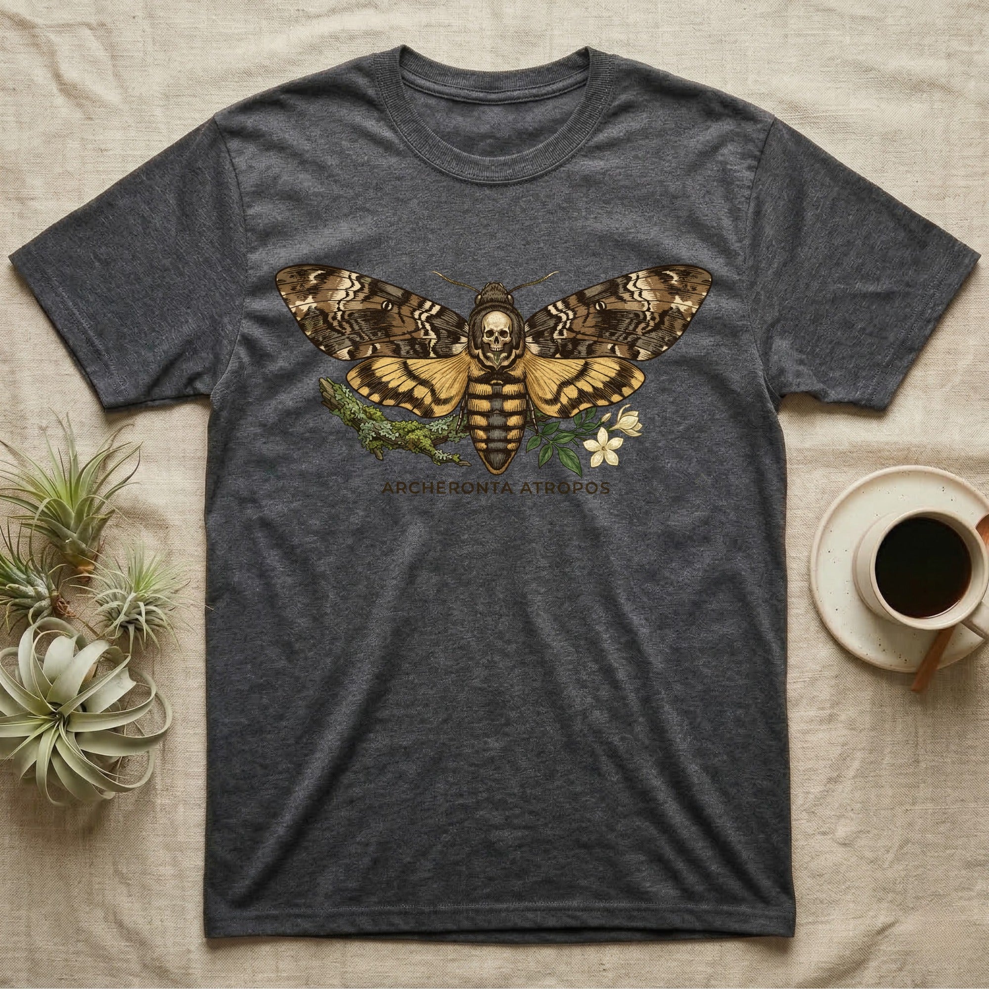 Dark t-shirt featuring a Death's-head hawkmoth graphic with text.