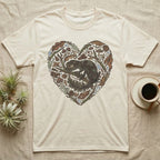 Cream t-shirt with a heart-shaped collage of natural elements and a gecko.