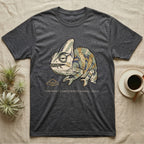 Unbothered Chameleon T-Shirt in Dark Heather — Ukiyo-e woodblock illustration of a veiled chameleon mid-chew with a deadpan serif caption beneath the subject.