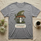 Grey t-shirt with a toad sitting on a mushroom, text reads "Professional Overthinker".