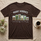 Reptile Terrarium Hobbies T-Shirt in Dark Chocolate — Watercolour row of reptile vivariums with a snake, dart frog, gecko, bearded dragon, tree frog and a cricket bin under MANY HOBBIES, each labelled carpentry to bug farming